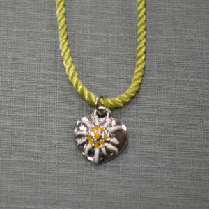 child's edelweiss and heart necklace
